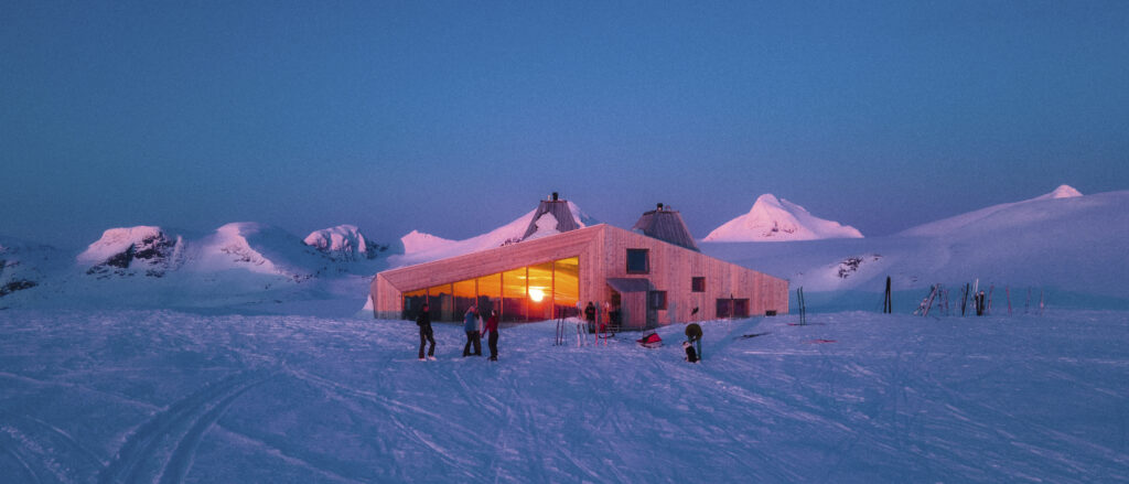 Rabothytta med skigåere utenfor en kveld på senvinteren